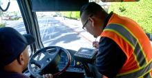 Supervisors inspecting a bus